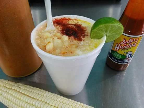 Elote en vaso: sweet corn in a cup with chili, lime and hot sauce.