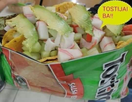 Tostilocos: a Tostitos bag loaded with cucumber, jicama, surimi and sliced avocado.